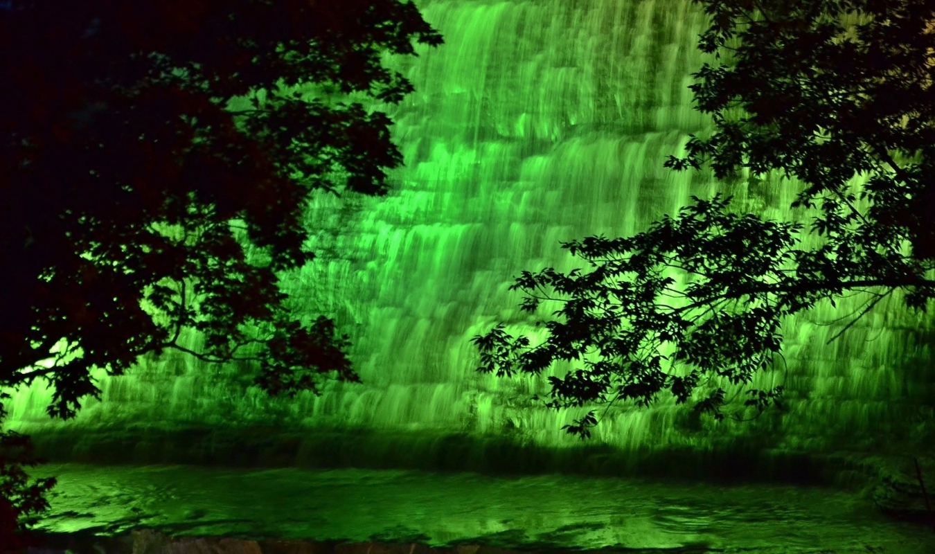 Albion Falls illuminated in Green