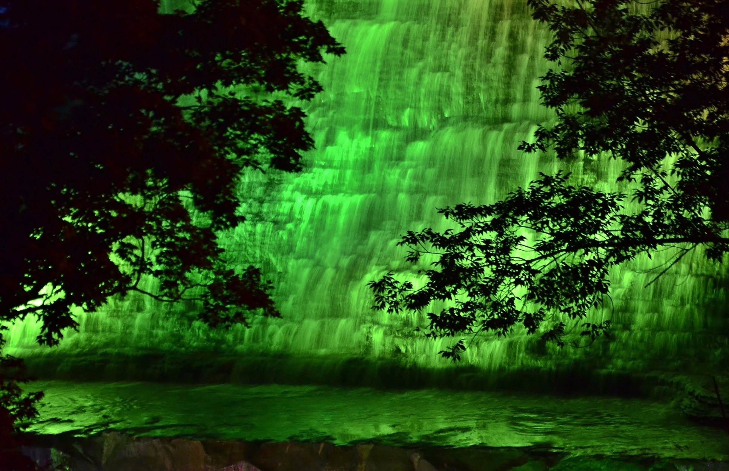 Albion Falls illuminated in Green